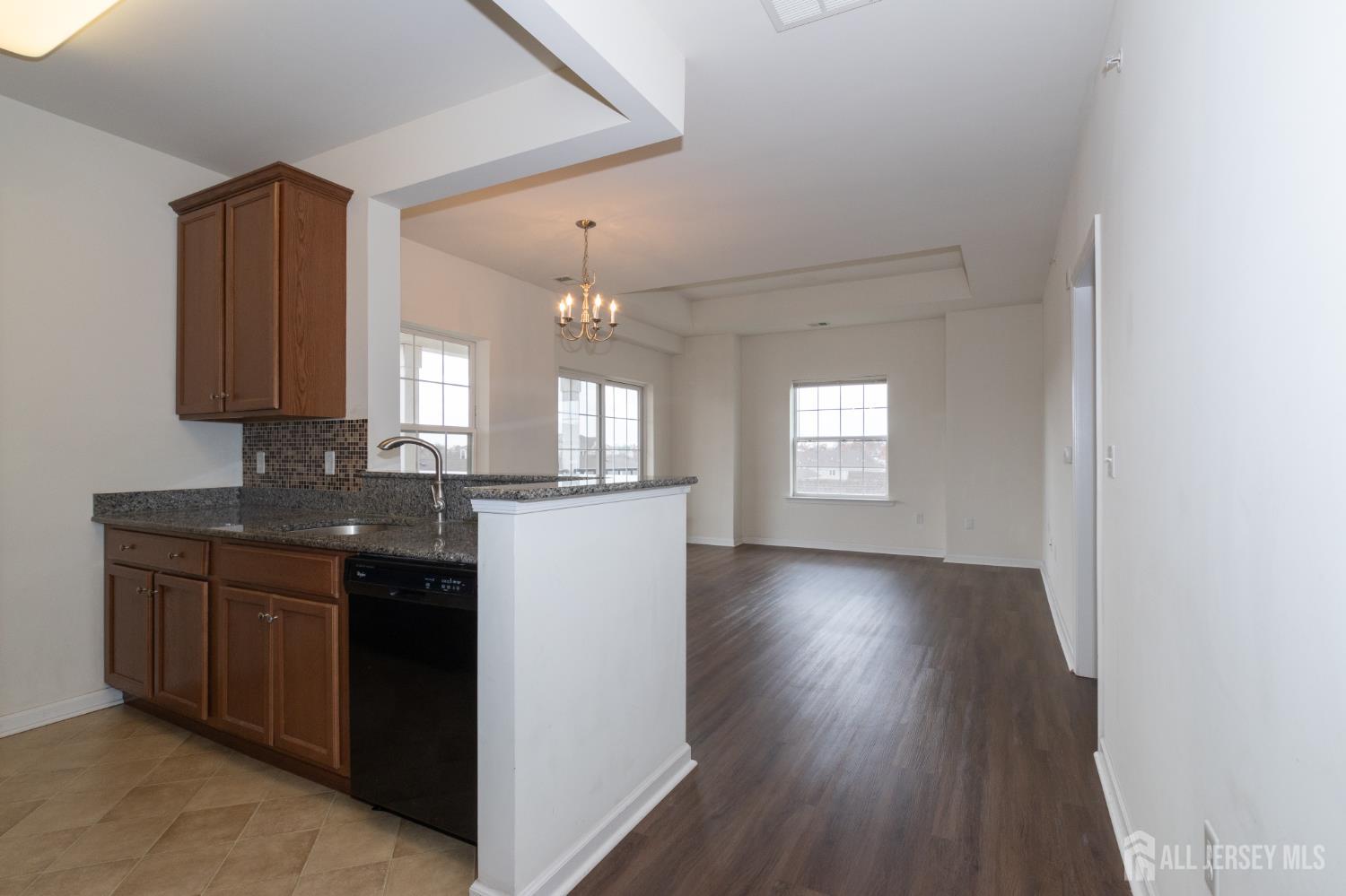 541 East Celebration Way South Plainfield, NJ 07080 - Photo 4 of 35 a view of a kitchen counter space and wooden floor