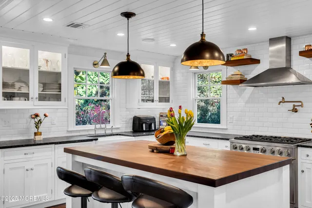 a view of hallway with furniture