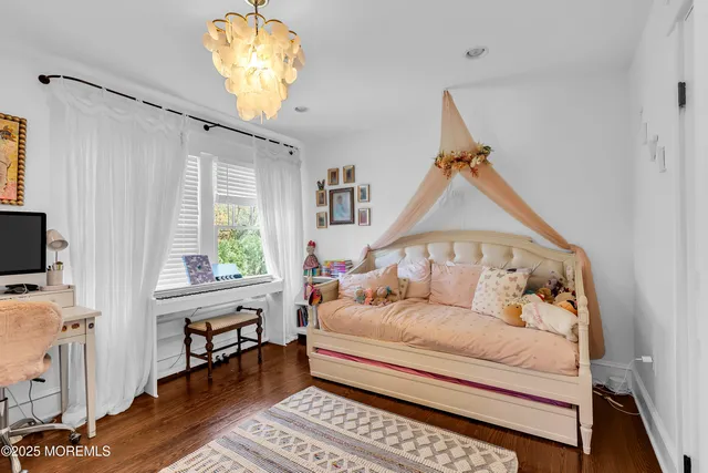 a bathroom with a sink and mirror with window