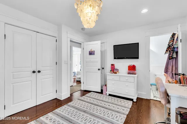 a view of a livingroom with furniture and staircase