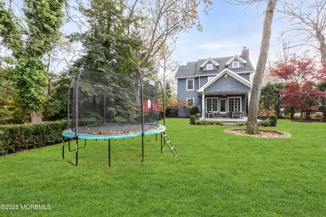 a view of a house with a yard porch and sitting area