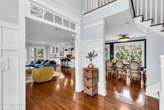 a living room with fireplace furniture and a flat screen tv