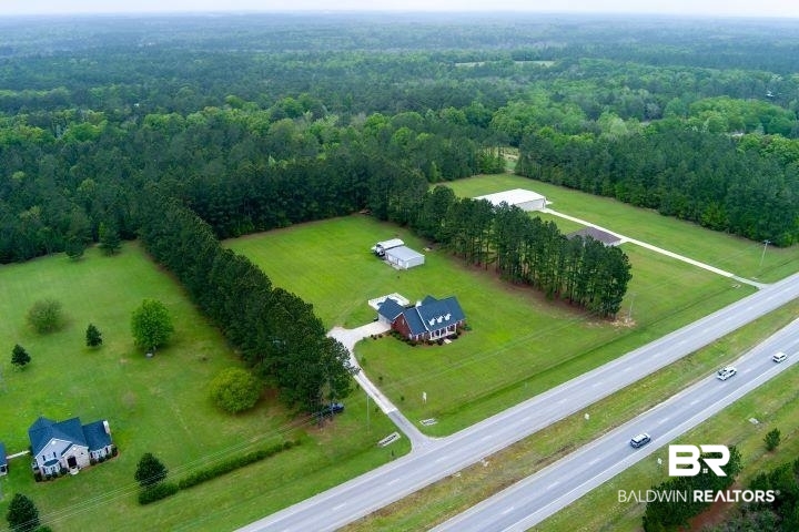 24541 Baldwin Beach Expressway Robertsdale, AL 36567 - Photo 39 of 51 Bird's eye view with a wooded view
