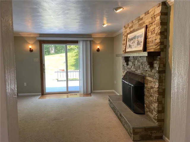 a view of livingroom with washer and dryer