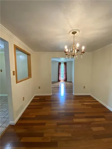 a view of a livingroom with wooden floor