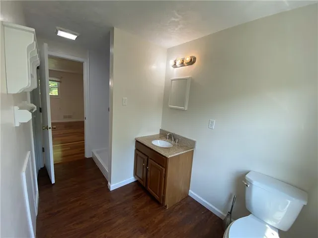a kitchen with a refrigerator and a stove