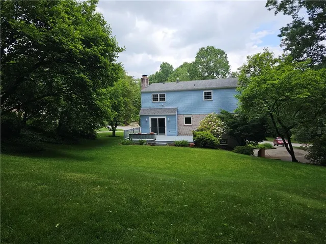 a view of a house with a big yard