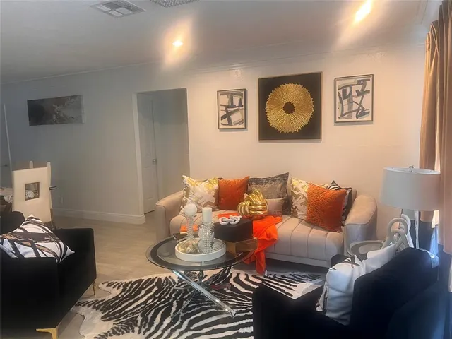 a living room with furniture and rug