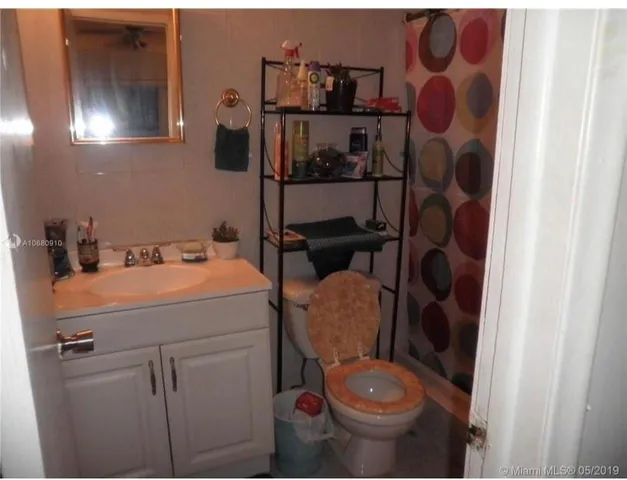 a bathroom with a toilet and a sink