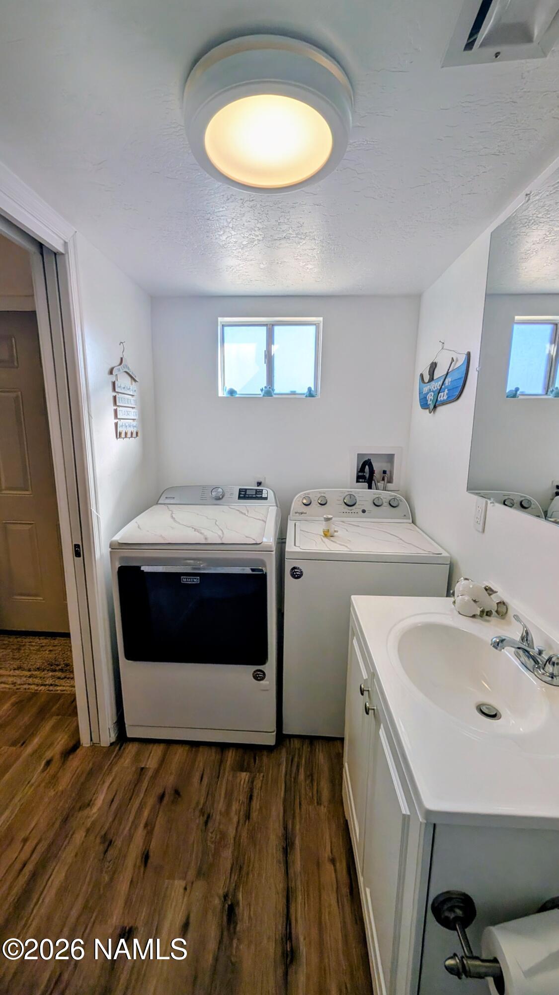 15702 Bonanza Loop Ehrenberg, AZ 85334 - Photo 13 of 13 a bathroom with a sink and a mirror