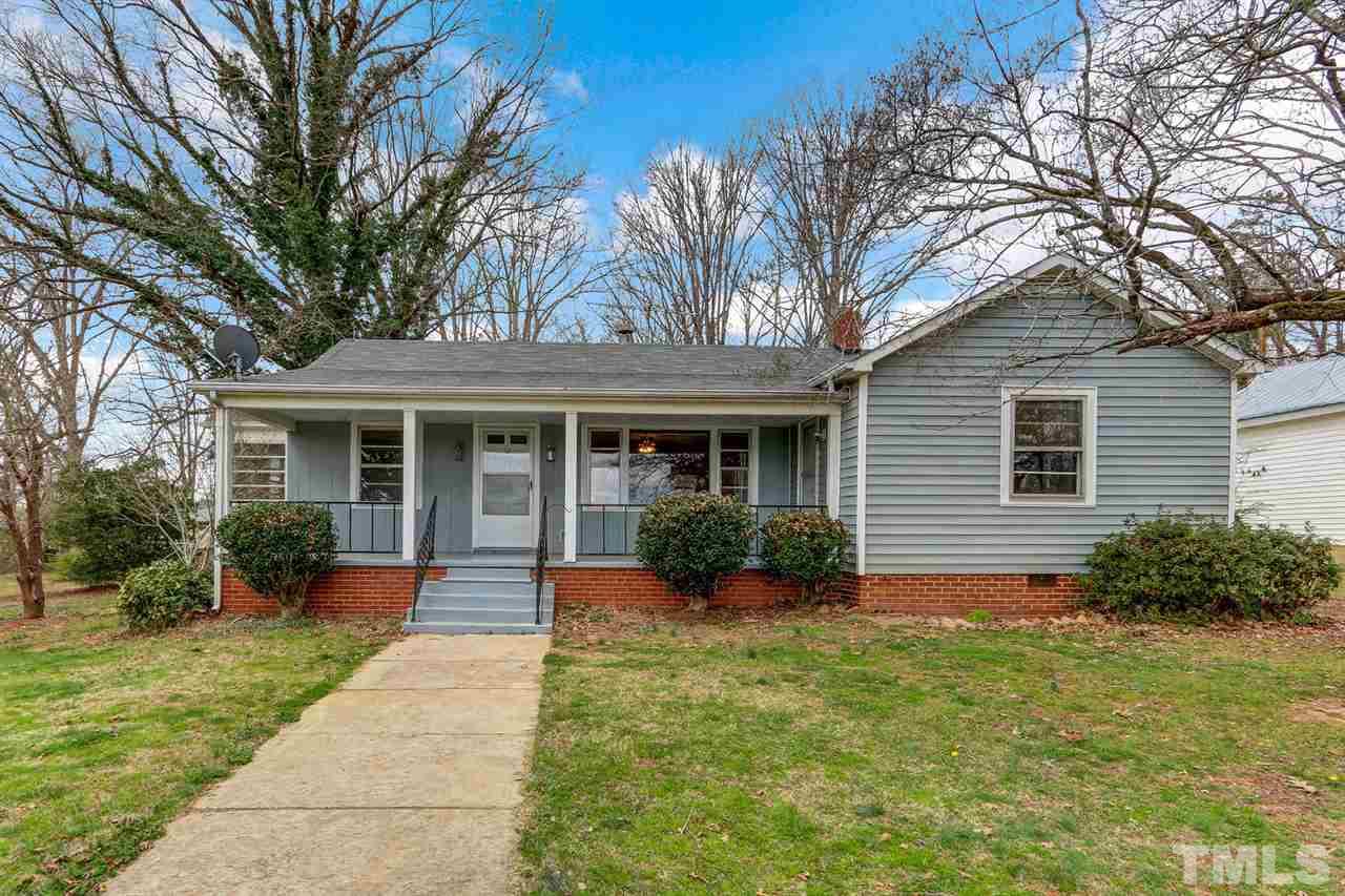 7146 Downsfield Road Randleman, NC 27317 - Photo 1 of 25 a front view of a house with garden and porch