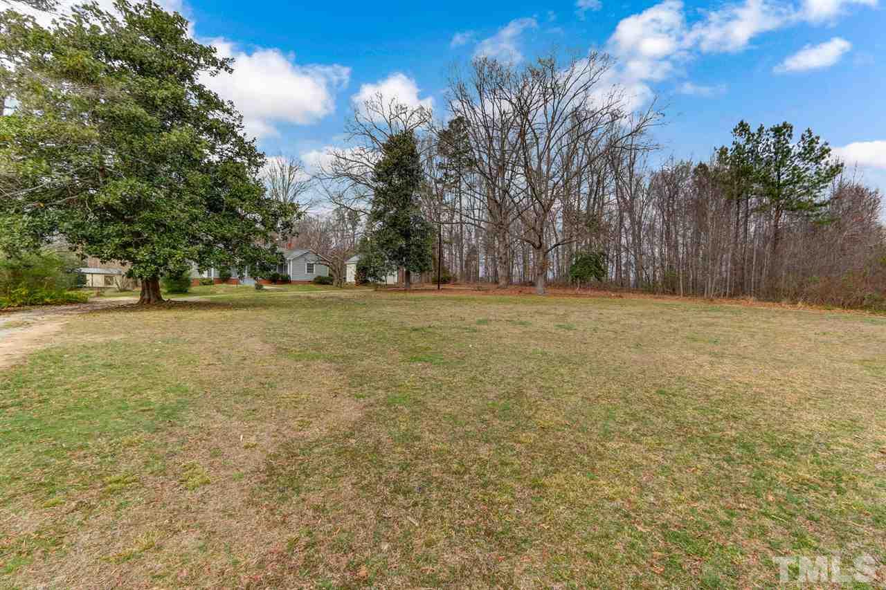7146 Downsfield Road Randleman, NC 27317 - Photo 4 of 25 a view of a yard with palm trees