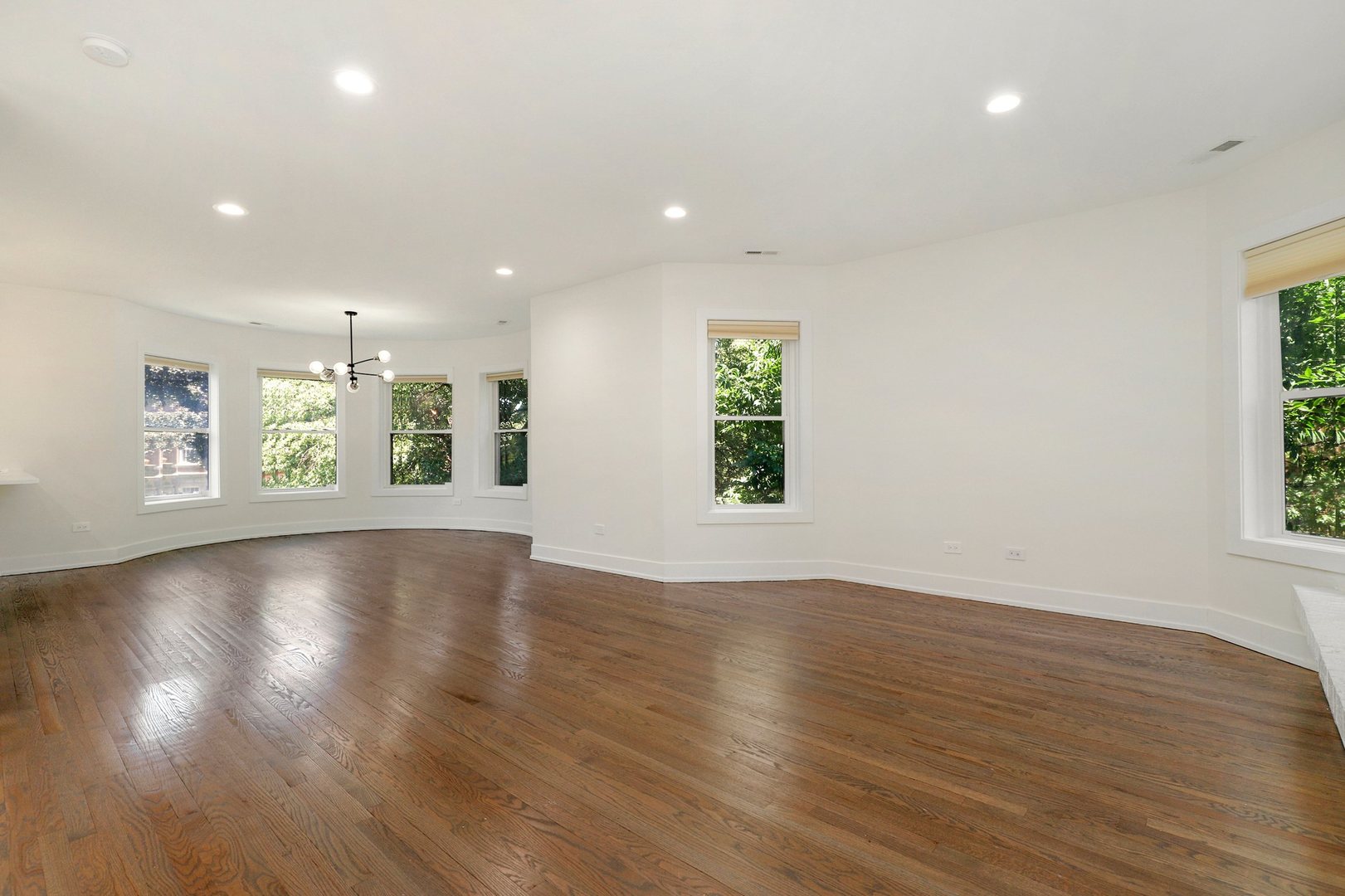 4065 North Sheridan Road, Unit 2N Chicago, IL 60613 - Photo 15 of 34 an empty room with wooden floor and windows