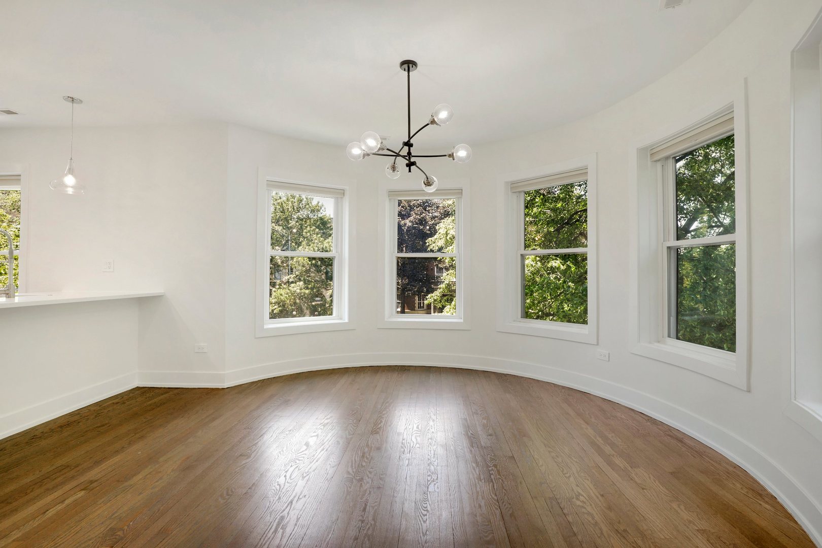 4065 North Sheridan Road, Unit 2N Chicago, IL 60613 - Photo 16 of 34 a view of an empty room with wooden floor and a window