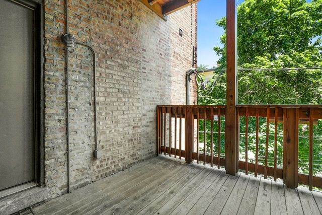 4065 North Sheridan Road, Unit 2N Chicago, IL 60613 - Photo 33 of 34 a view of a balcony with wooden floor