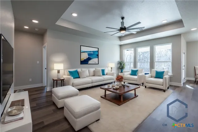a living room with furniture and a large window