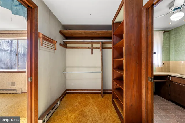 a bathroom with a sink a mirror and a shower