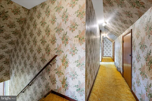 a view of a room with wooden walls