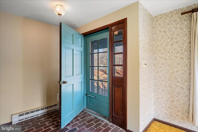 a living room with fireplace furniture and a fireplace