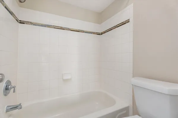 a close up of a bathtub in a bathroom