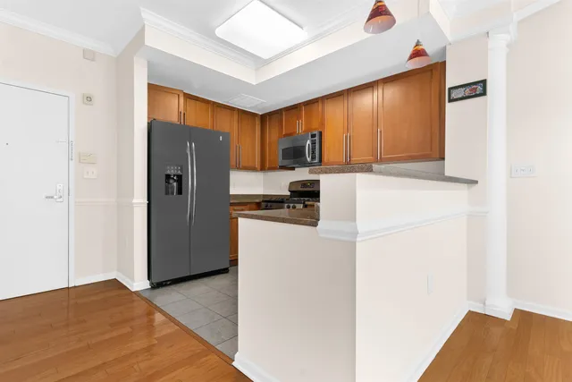 a kitchen with a refrigerator and a sink