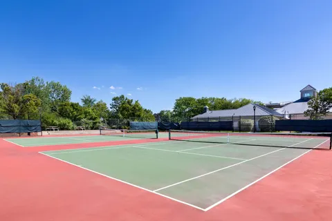 a view of an outdoor space and tennis court