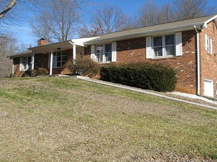 1377 Bore Auger Road Blue Ridge, VA 24064 - Photo 1 of 6 a front view of a house with garden