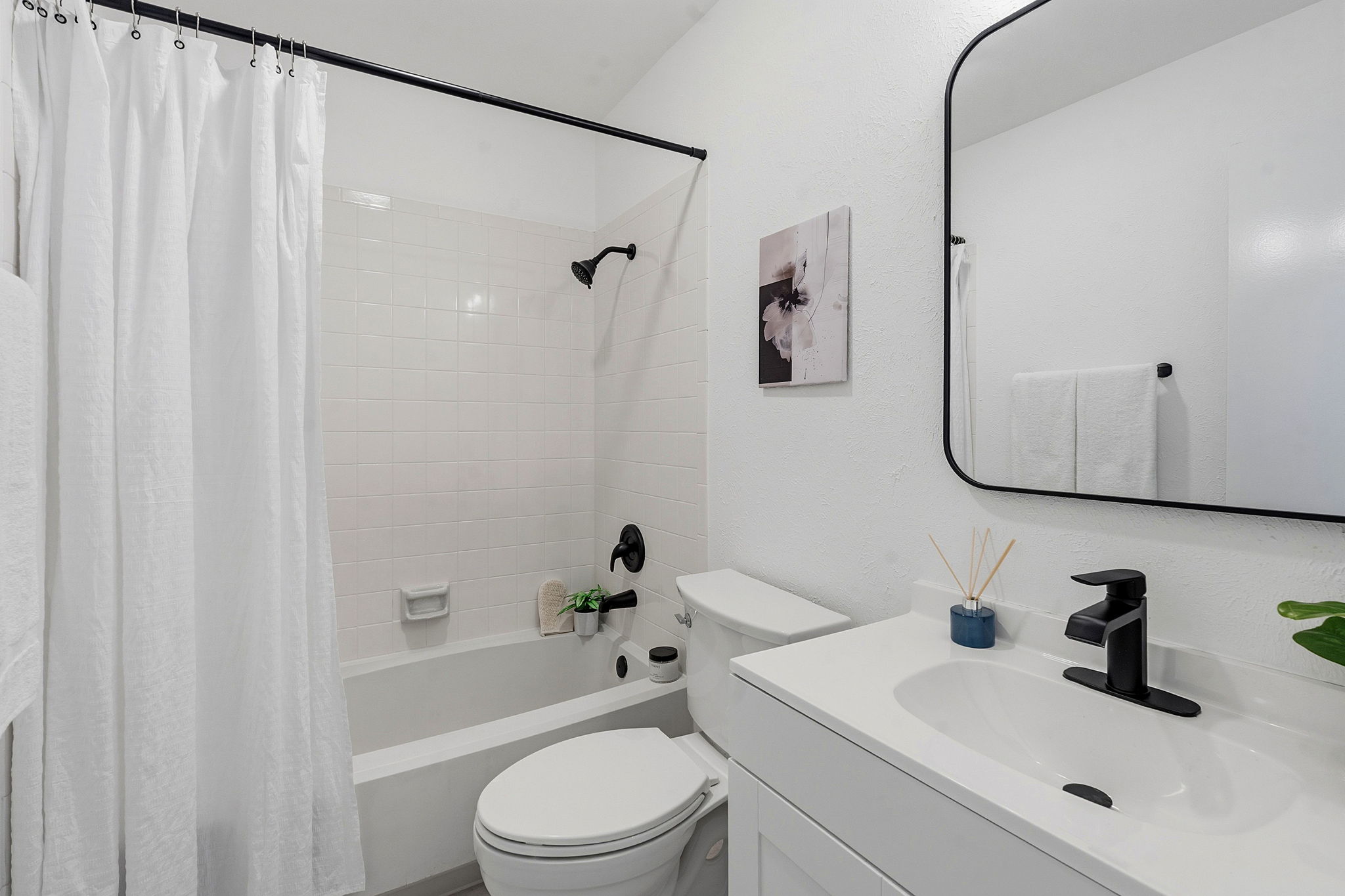 2702 Calabash Cove Austin, TX 78745 - Photo 22 of 40 a bathroom with a sink toilet and shower