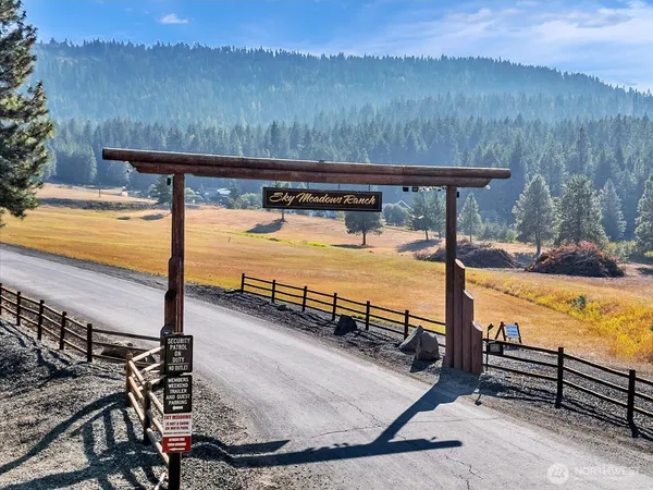a view of a swimming pool with a table and chairs