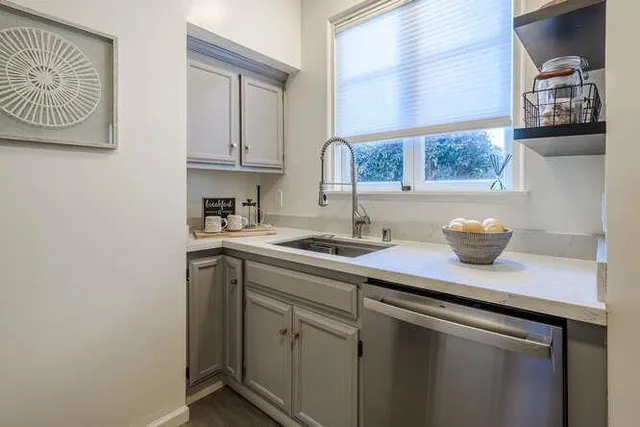 a kitchen with a sink and a window