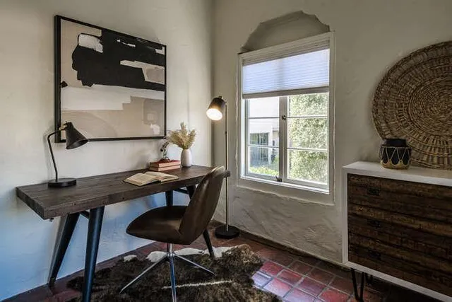 a view of a workspace with furniture