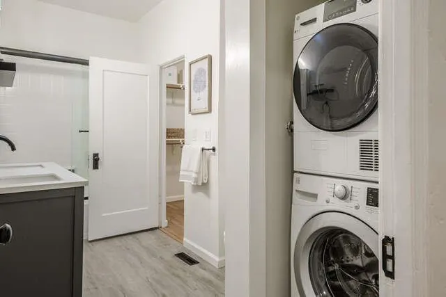 a view of a storage and utility room with a washer and dryer
