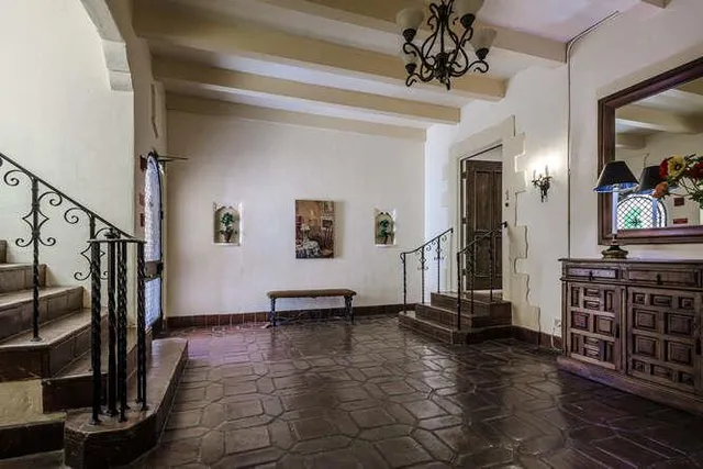a view of a hallway with seating area
