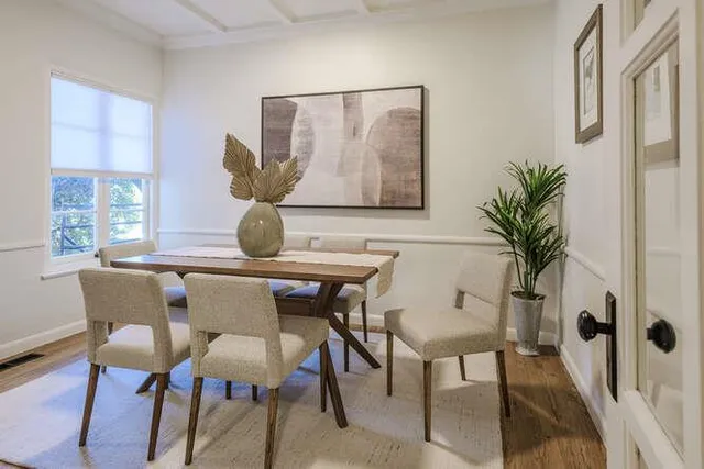 a view of a dining room with furniture and window