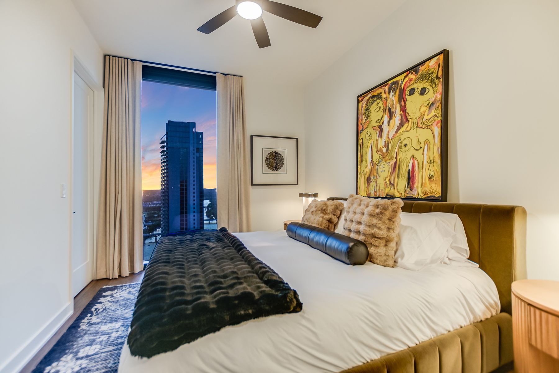 84 East Avenue, Unit 3909 Austin, TX 78701 - Photo 6 of 26 Bedroom with access to exterior and a ceiling fan