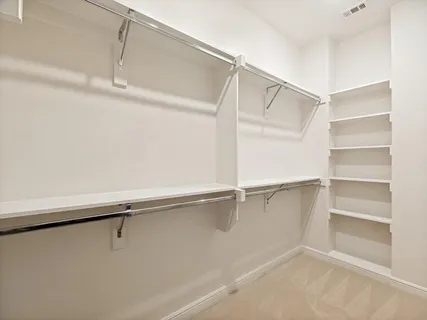 a view of an empty walk in closet
