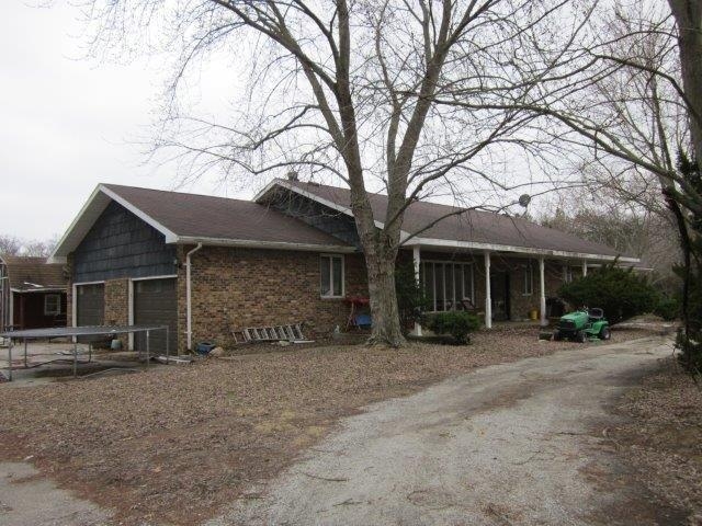 10095 East State Road Knox, IN 46534 - Photo 3 of 7 a view of a house with a large tree