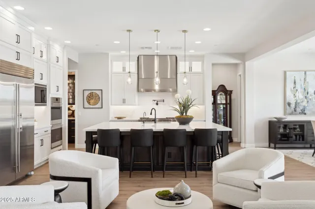 a large kitchen with a table and chairs
