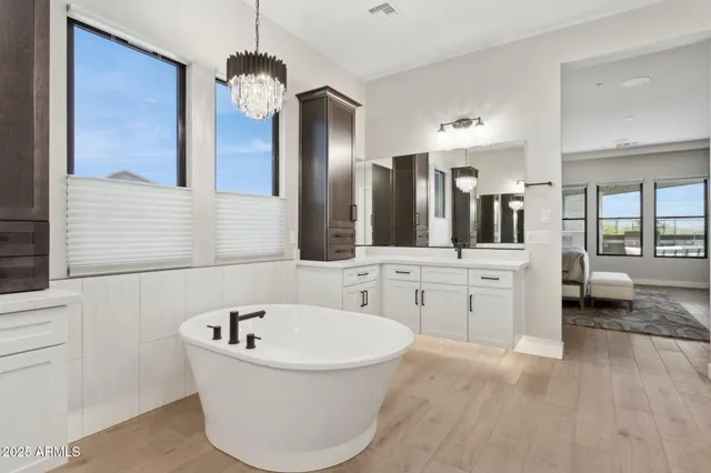 a living room with furniture and a book shelf
