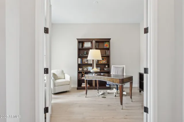 a bedroom with a bed and dresser