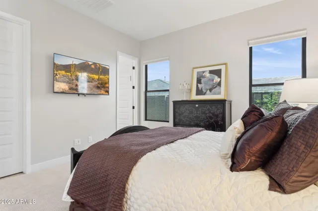a bathroom with a sink vanity mirror and toilet
