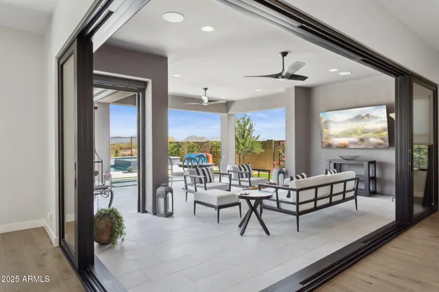a view of a patio with couches chairs and a stove