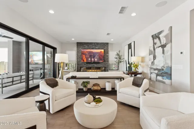 a living room with furniture and a large window