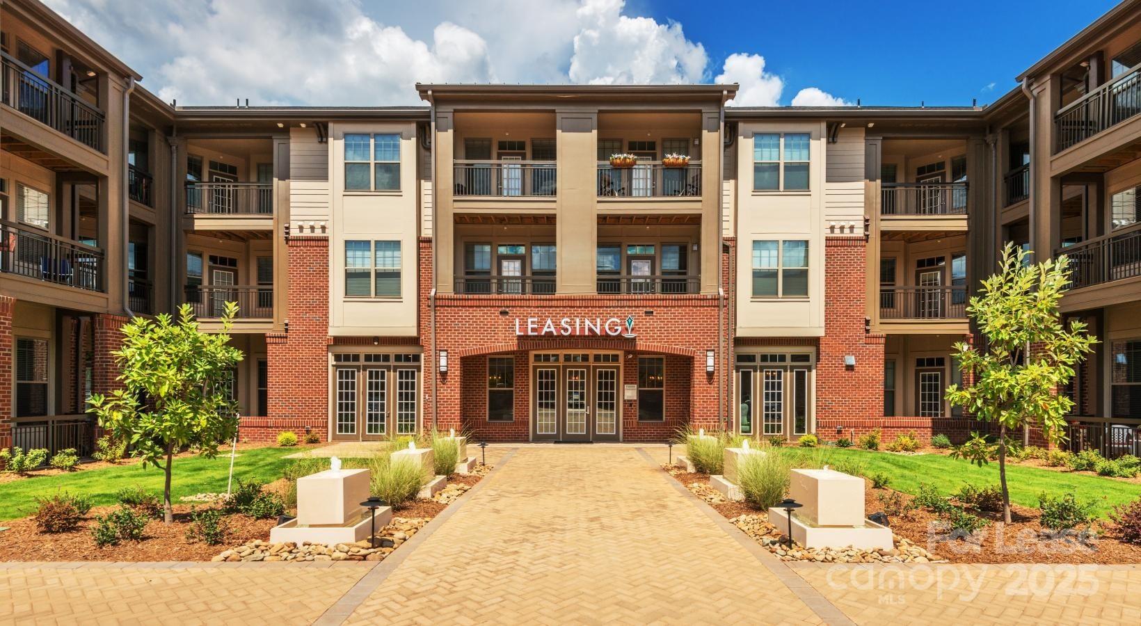 10624 Parrish Street, Unit A1 Matthews, NC 28105 - Photo 20 of 42 a front view of a brick building