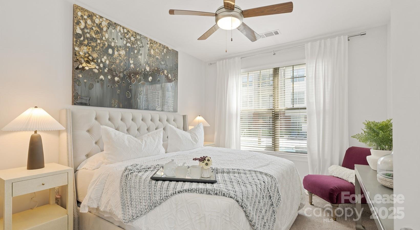 10624 Parrish Street, Unit A1 Matthews, NC 28105 - Photo 38 of 42 a bedroom with a bed and a window