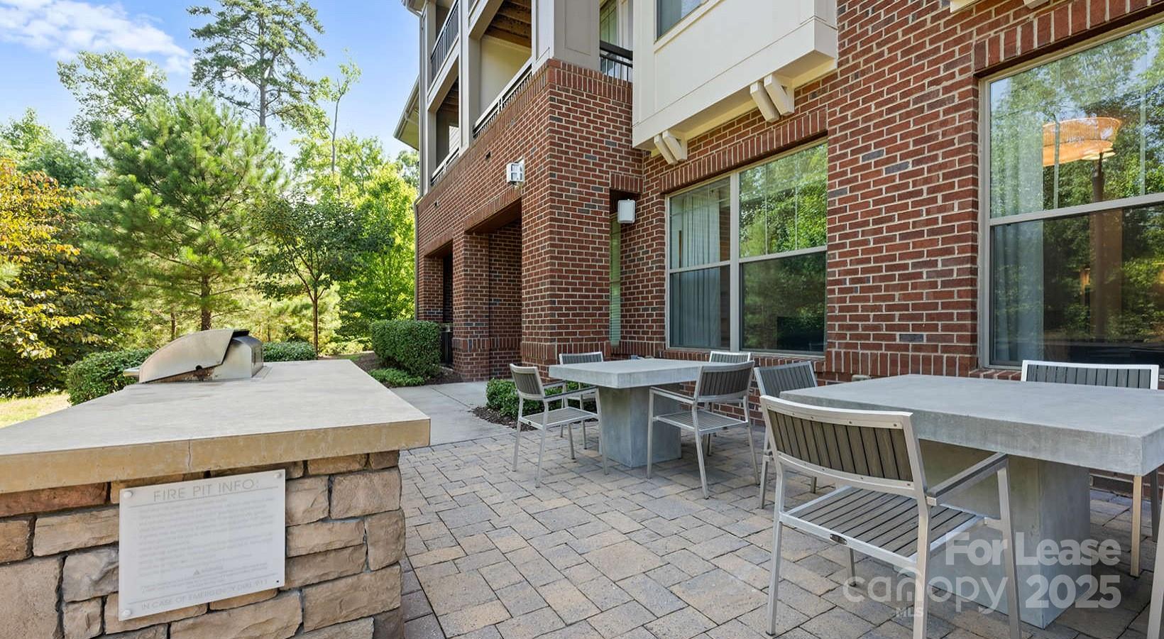 10624 Parrish Street, Unit A1 Matthews, NC 28105 - Photo 9 of 42 a patio with table and chairs