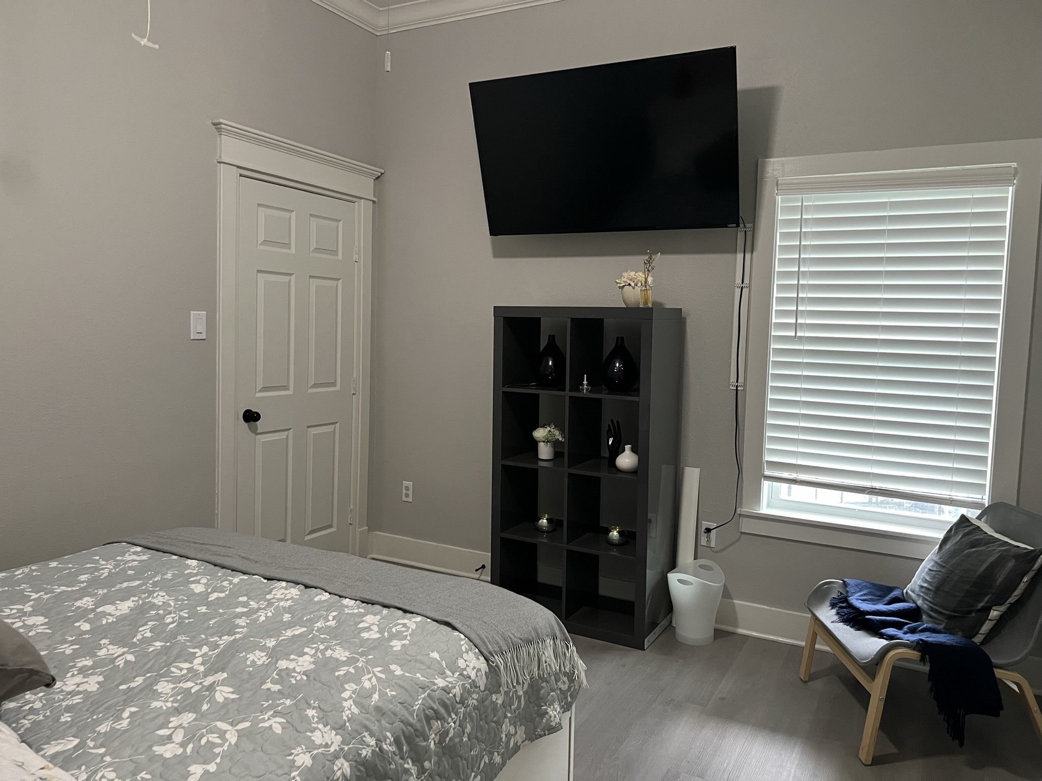 220 Redan Street, Unit A Houston, TX 77009 - Photo 18 of 22 a bedroom with a flat screen tv and bed