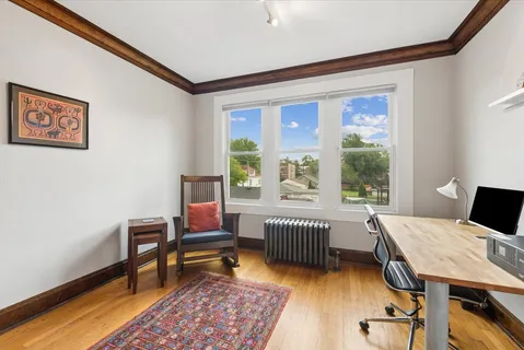 a workspace with furniture and a window