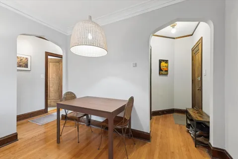 a workspace room with wooden floor and windows