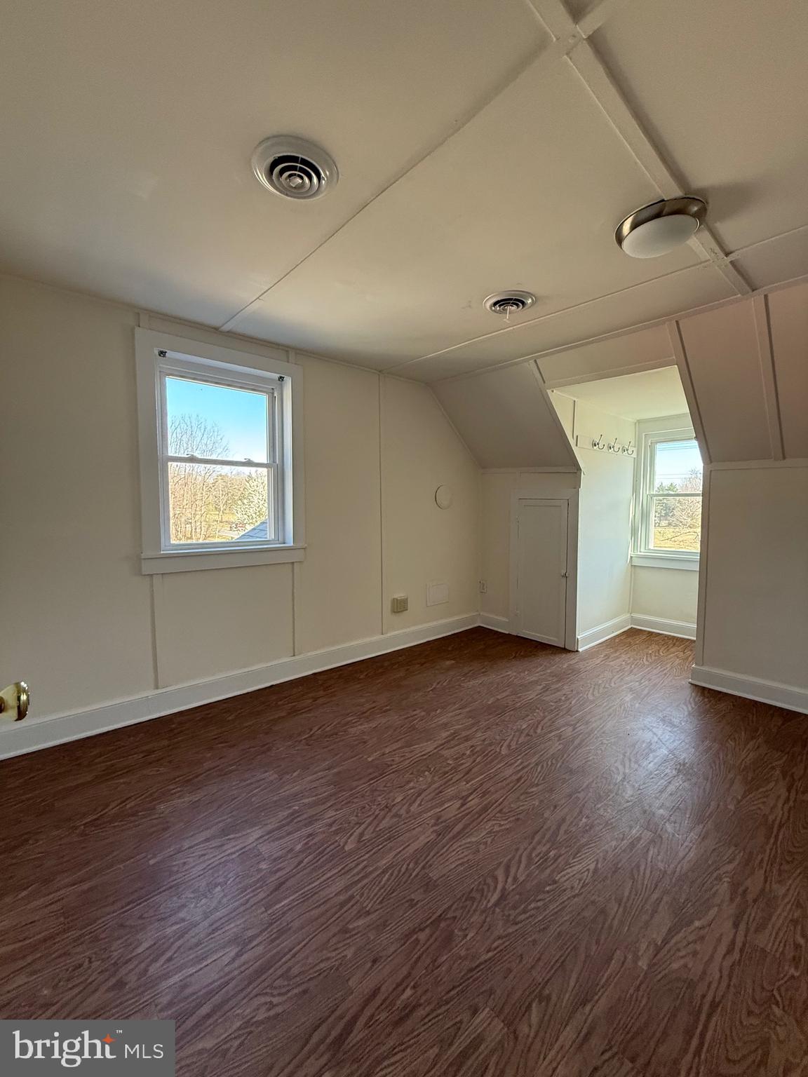9253 Dahlgren Road King George, VA 22485 - Photo 15 of 23 an empty room with wooden floor and windows
